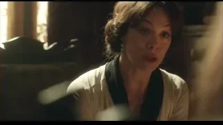 woman with serious expression in dimly lit room — Peaky Blinders