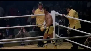 two men boxing with referee — Rocky III