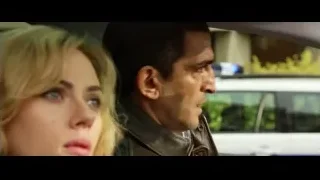 Man and woman in car with police lights — Lucy