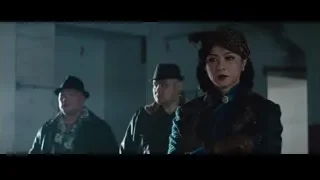 Three people in dim light with feathered hat — Bruce Lee: Birth of The Dragon