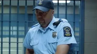police officer in uniform at metal gate — Suits