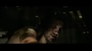Man's bloody face in dimly lit room — Gladiator 2