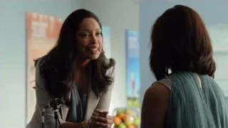Woman speaking into microphone to another woman — Suits
