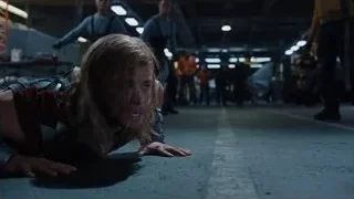 Man lying on stomach in warehouse — The Avengers