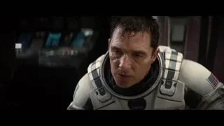 Man in space suit looking at camera — Interstellar