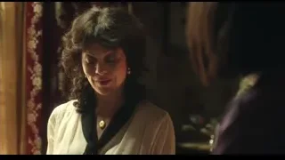 woman in dark room with red curtain — Peaky Blinders