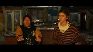 Two women interacting in dimly lit bar — Spiderman: No Way Home