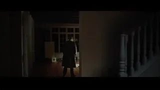 person walking through archway in dark room — Steve Jobs