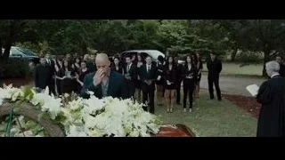 bald man in suit at casket in cemetery — Furious Seven