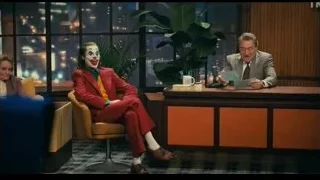 Joker sitting at table in restaurant — Joker