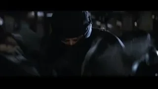 person in ninja mask holding a sword — Batman