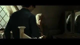 elderly woman holding scissors in dim room — Harry Potter and the Deathly Hallows 2