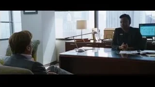man and woman conversing in office — The Big Short