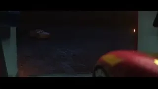 Orange car in dark parking lot with apple — Cars 3