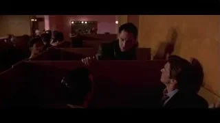 Man in suit in church pew — American Psycho