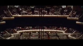 Large auditorium filled with people — Steve Jobs