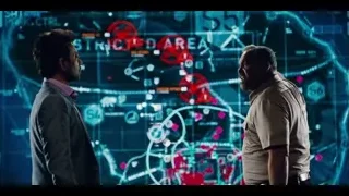 two men conversing by futuristic screen — Jurassic World