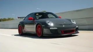 black Porsche 911 GT3 RS on race track — Sports Cars