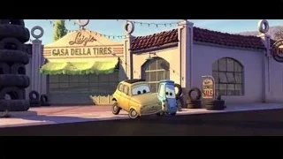 two cars in desert with sign — Cars