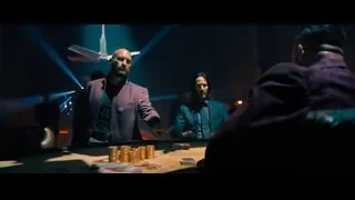 Men playing poker in dark room — John Wick: Chapter 4
