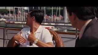 two men conversing on boat — The Wolf Of Wall Street