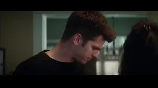 man and woman standing in dimly lit room — The Amazing Spider Man 2