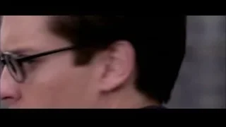 Man with serious expression wearing glasses — Spider Man 2