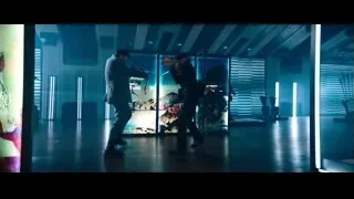 Two men walking in dimly lit art gallery — John Wick: Chapter 4