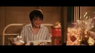 young boy sitting at table with food — Harry Potter and the Philosophers Stone