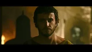 bearded man in tunic in dimly lit room — Gladiator 2