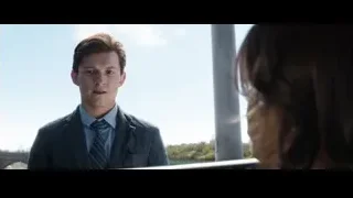 man in suit by window looking at woman — Spiderman: No Way Home