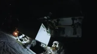 astronaut working on space station panel — Elon Musk: Return to Space