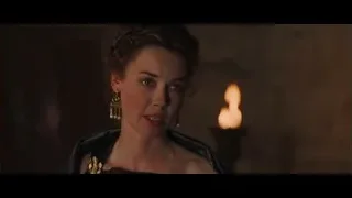 blonde woman in black dress by candle — Gladiator