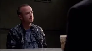 man sitting at table in dimly lit room — Breaking Bad