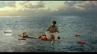 Man fishing on small boat in ocean — Life of Pi