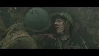 Soldier comforting wounded soldier in trench — Hacksaw Ridge