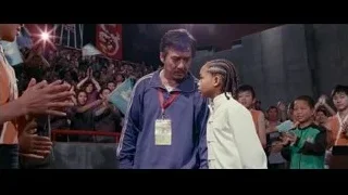 young boy in white outfit with crowd — The Karate Kid