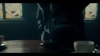 man at restaurant with stained glass window — Peaky Blinders