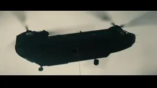 Black helicopter flying in cloudy sky — Superman: Man of Steel