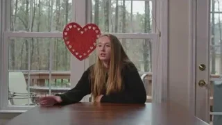 woman at table with heart decoration — Screened Out