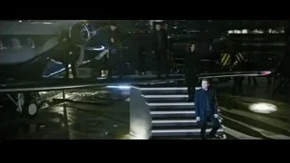 people on stairs by private jet at night — Now You See Me 2