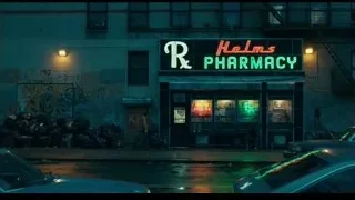 Helms Pharmacy neon sign on old building — Joker
