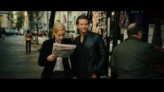people reading newspaper on busy street — Limitless