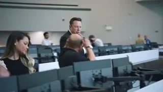 Man in suit giving presentation — Elon Musk: Return to Space