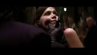 woman cutting man's face with knife — Batman: The Dark Knight
