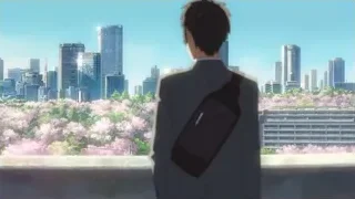 man on balcony viewing city cherry blossoms — Your Name