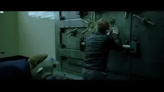 two men working on metal door — Batman: The Dark Knight