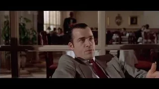 man in suit in restaurant — American Psycho