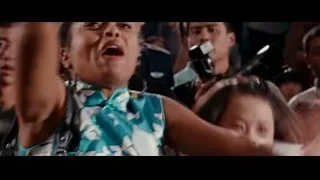 young girl speaking into microphone on stage — The Karate Kid