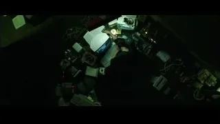person working at cluttered desk — The Matrix